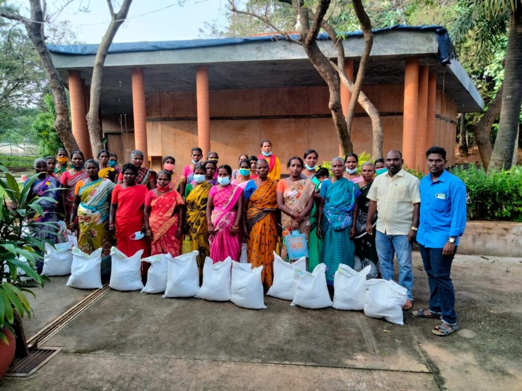 Sanjeevan volunteers unloading essential food kits to bring relief to the affected